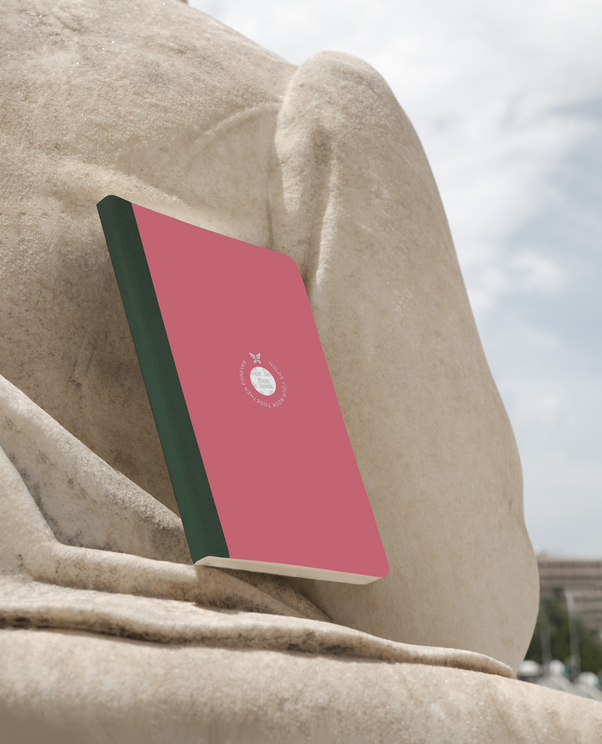 a notebook on a marble statue 